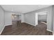 Open layout showing living room leading to dining area with hardwood floors at 5854 Cobalt Dr, Powder Springs, GA 30127