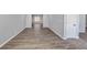 Hardwood floors flow seamlessly through an open space with natural light at 5854 Cobalt Dr, Powder Springs, GA 30127
