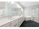 Primary bathroom with double sink vanity, soaking tub, and glass shower at 936 Bramble Oak Ct, Powder Springs, GA 30127