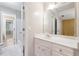 Bathroom featuring a large vanity, mirror and tub at 936 Bramble Oak Ct, Powder Springs, GA 30127