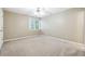 Neutral bedroom with ceiling fan, carpet and a window at 936 Bramble Oak Ct, Powder Springs, GA 30127