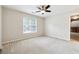 Bedroom with neutral carpet, paint and ceiling fan at 936 Bramble Oak Ct, Powder Springs, GA 30127