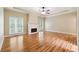 Bright living room features high ceiling, fireplace and wood floors at 936 Bramble Oak Ct, Powder Springs, GA 30127