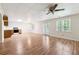 Finished basement living room with kitchenette, tile ceiling and laminate flooring, featuring natural light at 936 Bramble Oak Ct, Powder Springs, GA 30127