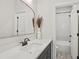 Modern bathroom with sleek vanity, large mirror, and tiled shower at 123 Cricket Ln, Alpharetta, GA 30009