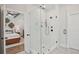 Elegant bathroom featuring glass shower and view into the main bedroom at 123 Cricket Ln, Alpharetta, GA 30009