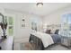 Bright bedroom featuring large windows, plantation shutters, and stylish decor at 123 Cricket Ln, Alpharetta, GA 30009