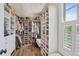 Spacious walk-in closet with custom shelving and ample storage space at 123 Cricket Ln, Alpharetta, GA 30009