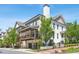 Beautiful multi-story home showcasing a screened porch and white-painted brick exterior with well-manicured landscaping at 123 Cricket Ln, Alpharetta, GA 30009
