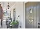 Inviting covered porch with rocking chairs, decorative lanterns, and a charming wreath on the front door at 123 Cricket Ln, Alpharetta, GA 30009