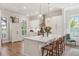 Bright, modern kitchen with a large island, white cabinetry, and stainless steel appliances at 123 Cricket Ln, Alpharetta, GA 30009