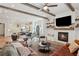 Open-concept living room with wood beams, fireplace, and view to the kitchen at 123 Cricket Ln, Alpharetta, GA 30009