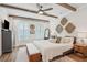 Inviting main bedroom with tray ceiling, ceiling fan and cozy furnishings at 123 Cricket Ln, Alpharetta, GA 30009