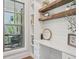 Bright home office with built-in desk, shelving, and natural light at 123 Cricket Ln, Alpharetta, GA 30009