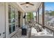 Relaxing screened porch with comfortable seating and an outdoor grill at 123 Cricket Ln, Alpharetta, GA 30009