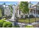 Community entrance sign reading 'East of Main Est. 2017', surrounded by lush greenery and a wrought iron fence at 123 Cricket Ln, Alpharetta, GA 30009