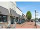 Charming retail storefront with outdoor seating area, awnings, and street view in Alpharetta at 123 Cricket Ln, Alpharetta, GA 30009