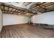 Unfinished basement with wood floor and exposed ceiling at 474 Waterford Nw Rd, Atlanta, GA 30318