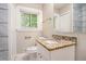 Bathroom featuring granite vanity top, white cabinets, and decorative tile at 474 Waterford Nw Rd, Atlanta, GA 30318
