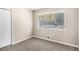 Cozy bedroom with soft carpet, closet, and natural light from a bright window at 474 Waterford Nw Rd, Atlanta, GA 30318