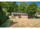 Charming single-story brick home with a well-maintained lawn and mature trees in a desirable neighborhood at 474 Waterford Nw Rd, Atlanta, GA 30318