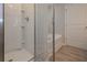 Bathroom featuring a glass shower door and soaking tub at 488 Charleston Pl, Villa Rica, GA 30180