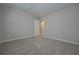 This bedroom features neutral walls and soft carpet for a cozy feel at 488 Charleston Pl, Villa Rica, GA 30180