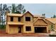 Unfinished exterior view of a two-story home with a two-car garage and wood-frame construction at 488 Charleston Pl, Villa Rica, GA 30180