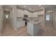 Modern kitchen with white cabinets, stainless steel appliances, and a kitchen island at 488 Charleston Pl, Villa Rica, GA 30180