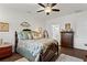 Cozy bedroom with lots of natural light, comfortable furnishings, and direct access to bathroom at 5520 Allegre Pl, Cumming, GA 30028