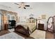 Cozy bedroom with lots of natural light, fan, and comfortable furnishings at 5520 Allegre Pl, Cumming, GA 30028