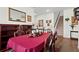 Elegant dining room featuring hardwood floors, a large table, and classic decor at 5520 Allegre Pl, Cumming, GA 30028