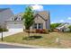 Beautifully landscaped front yard with a well-maintained lawn and charming curb appeal at 5520 Allegre Pl, Cumming, GA 30028