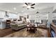 Cozy living room featuring a ceiling fan, plush seating, and stylish decor at 5520 Allegre Pl, Cumming, GA 30028