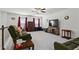 Cozy upstairs living room with ceiling fan, carpeted floors and comfortable sofas at 5520 Allegre Pl, Cumming, GA 30028