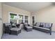 Outdoor patio with comfortable seating and a view of the backyard at 5520 Allegre Pl, Cumming, GA 30028
