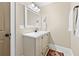 Bright bathroom with a neutral vanity, framed mirror, and soft decor at 2620 Margaret Mitchell Dr, Atlanta, GA 30327