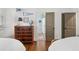 Bedroom view featuring antique chest of drawers with access to bathroom and closet at 2620 Margaret Mitchell Dr, Atlanta, GA 30327