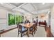 Elegant dining room with coffered ceilings, classic details and natural light streaming through a large window at 2620 Margaret Mitchell Dr, Atlanta, GA 30327