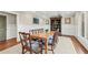 Formal dining room with hardwood floors, wainscoting, coffered ceiling, and a large dining table at 2620 Margaret Mitchell Dr, Atlanta, GA 30327