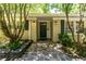 Inviting home entrance with a stone pathway, decorative lanterns, and fresh landscaping at 2620 Margaret Mitchell Dr, Atlanta, GA 30327