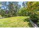 Spacious front yard with a well-maintained lawn and mature trees, offering a picturesque setting at 2620 Margaret Mitchell Dr, Atlanta, GA 30327