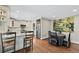 Open kitchen and dining area with stainless steel appliances, granite countertops, and hardwood floors at 2620 Margaret Mitchell Dr, Atlanta, GA 30327