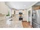 Bright kitchen with white cabinets, stainless steel appliances and granite countertops at 2620 Margaret Mitchell Dr, Atlanta, GA 30327