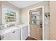 Laundry room with washer, dryer, and window with natural light at 2620 Margaret Mitchell Dr, Atlanta, GA 30327