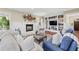 Living room with built-in bookshelves, a fireplace, ample natural light, and cozy seating at 2620 Margaret Mitchell Dr, Atlanta, GA 30327