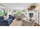 Spacious living room with fireplace, hardwood floors, large windows and comfortable seating at 2620 Margaret Mitchell Dr, Atlanta, GA 30327