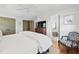 Main bedroom view with closet, bathroom, TV, and chair at 2620 Margaret Mitchell Dr, Atlanta, GA 30327