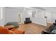 Finished basement with wood-look floors, neutral walls, and a cozy seating area at 3595 South Nw St, Duluth, GA 30096