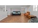 Spacious basement features hardwood floors, modern seating, and ample natural light at 3595 South Nw St, Duluth, GA 30096